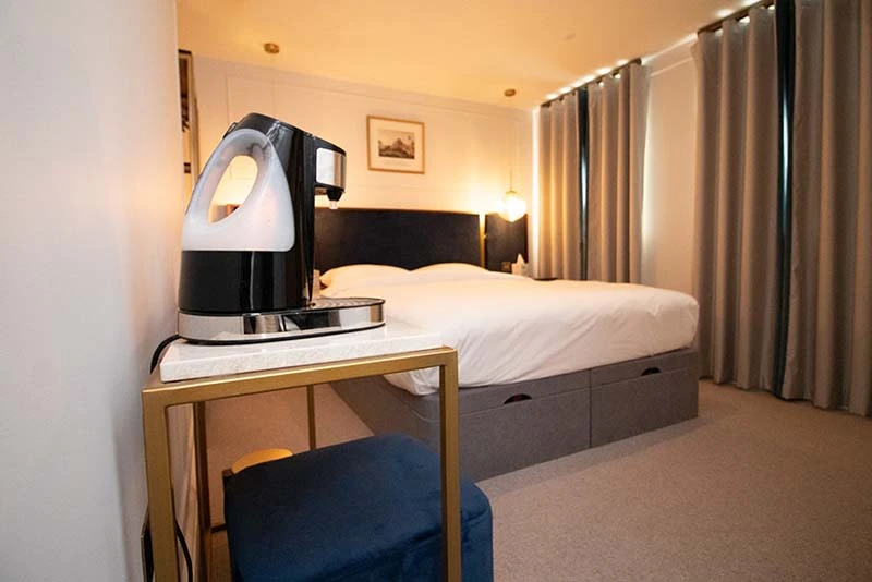 Cozy hotel room featuring a tea station